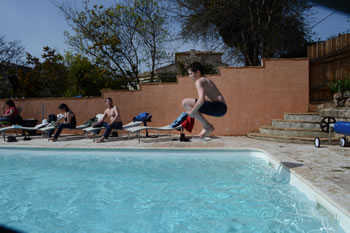 Ben jumping in the pool